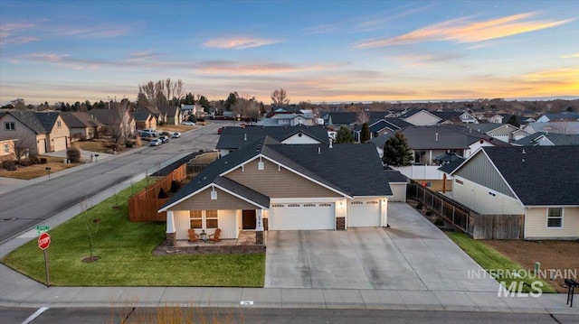 aerial view at dusk with a residential view