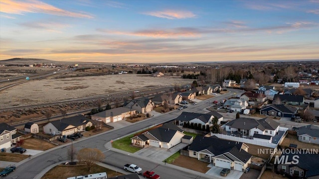 aerial view at dusk with a residential view