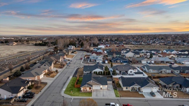 aerial view at dusk with a residential view