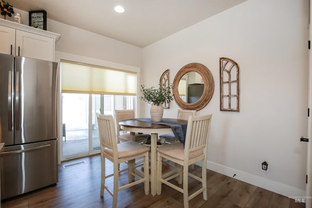 dining room featuring recessed lighting, dark wood finished floors, visible vents, and baseboards