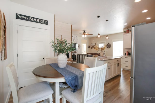 dining room featuring ceiling fan, wood finished floors, and recessed lighting