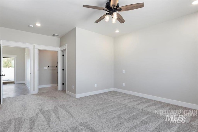 unfurnished bedroom featuring baseboards, recessed lighting, light carpet, and a ceiling fan