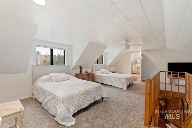 bedroom featuring lofted ceiling and carpet