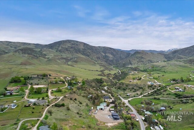 aerial overview of property's location with a mountainous background
