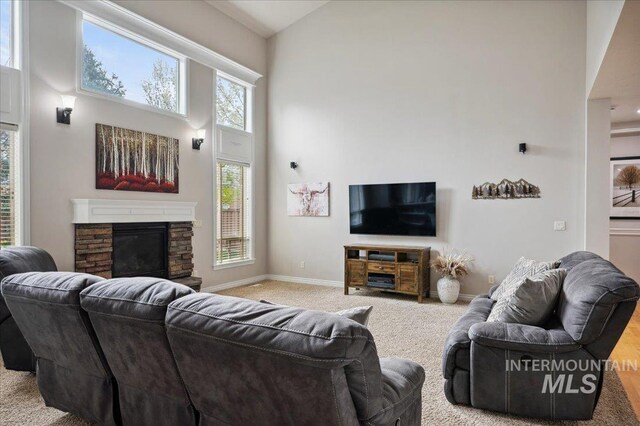 4824 S Longmoor Ave, Boise, ID 83709 - living room with carpet floors, a wealth of natural light, a high ceiling, and baseboards