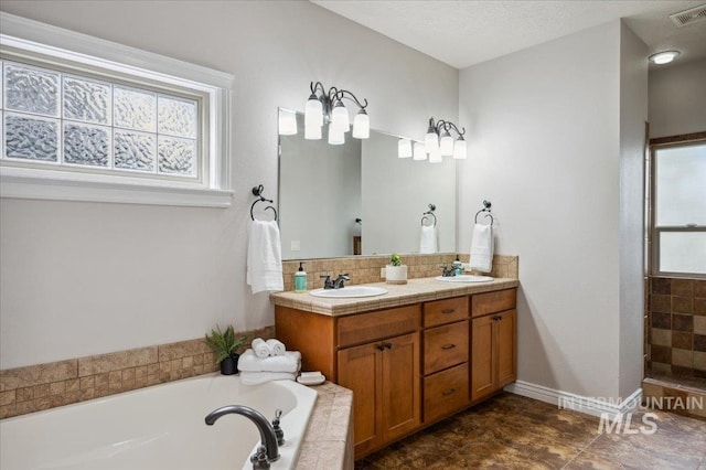 4824 S Longmoor Ave, Boise, ID 83709 - full bath featuring a sink, visible vents, a bath, and a healthy amount of sunlight