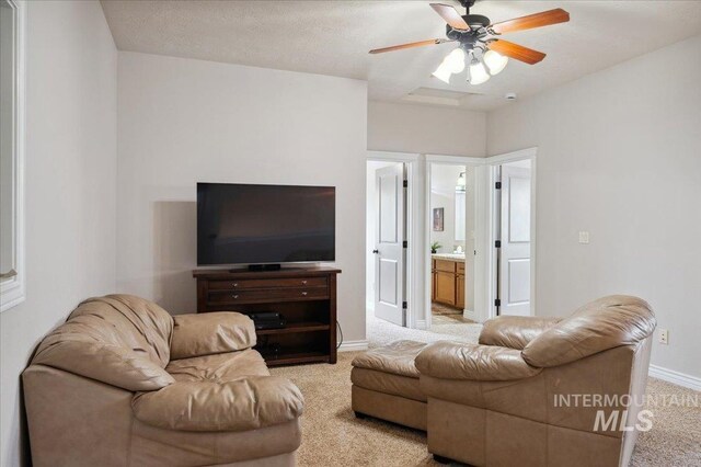 4824 S Longmoor Ave, Boise, ID 83709 - living room with ceiling fan, light colored carpet, and baseboards