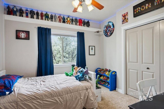 4824 S Longmoor Ave, Boise, ID 83709 - carpeted bedroom with a closet and a ceiling fan