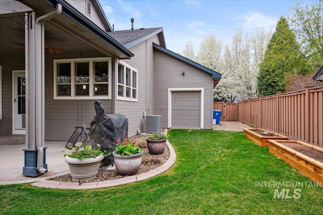 4824 S Longmoor Ave, Boise, ID 83709 - view of yard featuring central AC unit, a garden, and fence