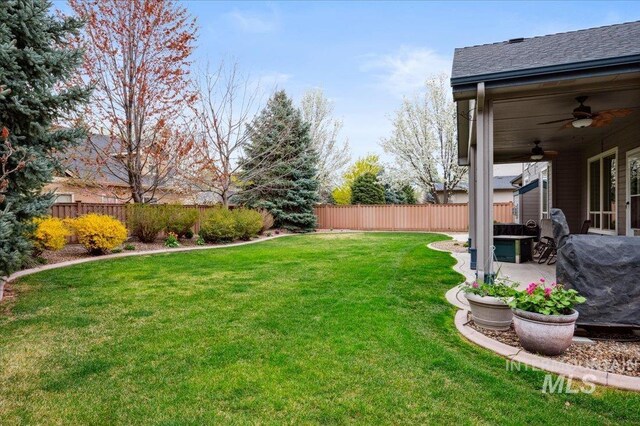4824 S Longmoor Ave, Boise, ID 83709 - view of yard with ceiling fan, a fenced backyard, and a patio area