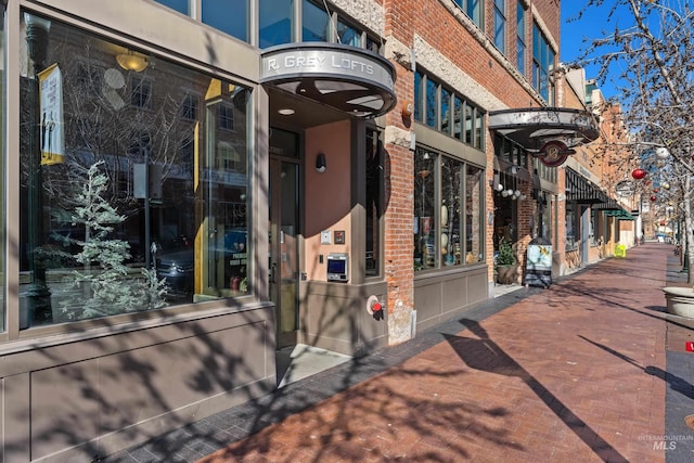 property entrance with brick siding