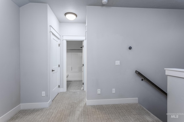 washroom featuring carpet floors and baseboards