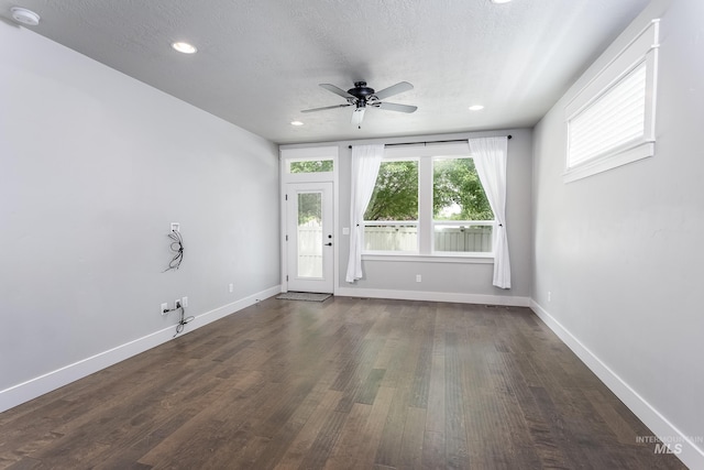 spare room featuring a smoke detector, ceiling fan, dark wood-style floors, baseboards, and recessed lighting