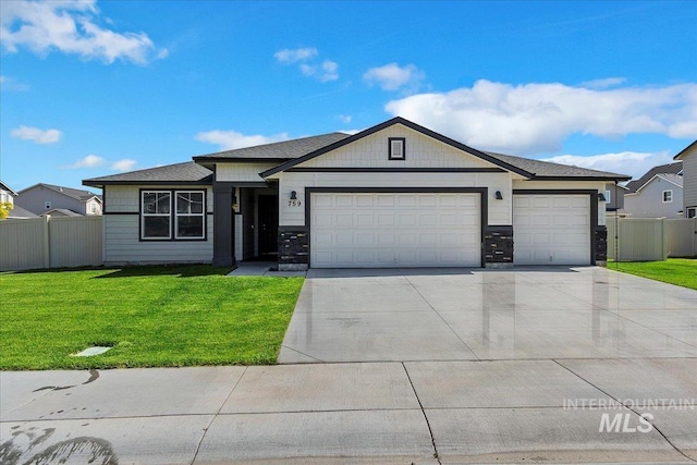 ranch-style home with a garage and a front lawn