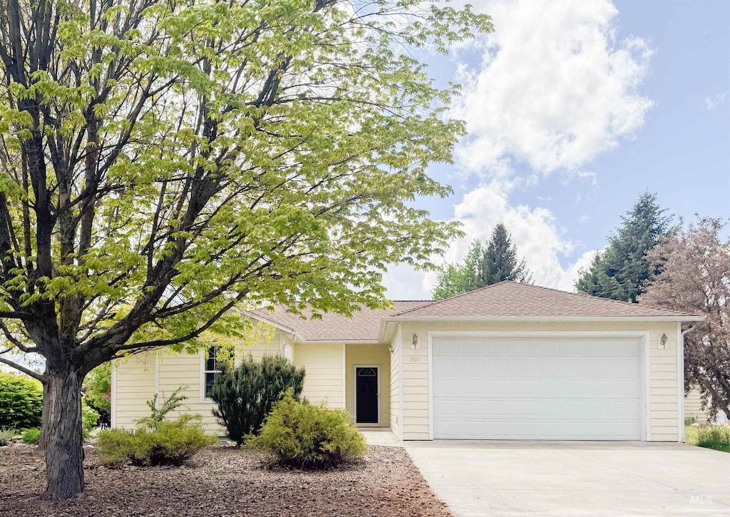 1937 E Vandal Dr, Moscow, ID 83843 - ranch-style home with driveway and an attached garage