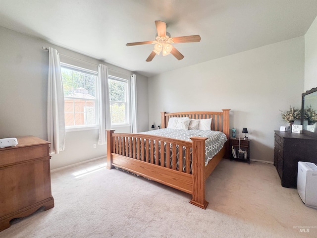 1937 E Vandal Dr, Moscow, ID 83843 - bedroom with light colored carpet, a ceiling fan, and baseboards