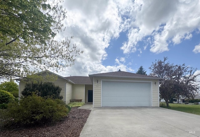 1937 E Vandal Dr, Moscow, ID 83843 - ranch-style house featuring concrete driveway and a garage