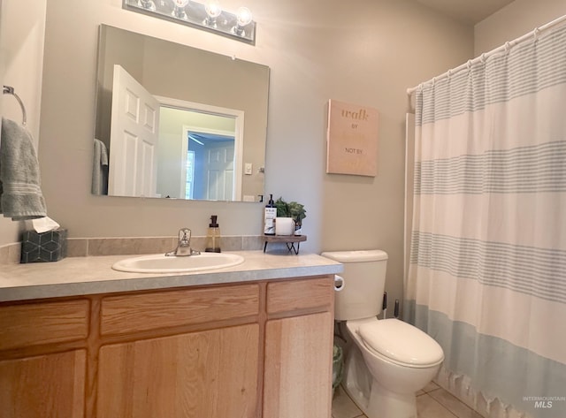 1937 E Vandal Dr, Moscow, ID 83843 - full bath featuring vanity, tile patterned floors, toilet, and a shower with shower curtain