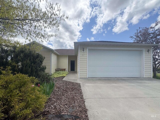1937 E Vandal Dr, Moscow, ID 83843 - ranch-style home with driveway and a garage