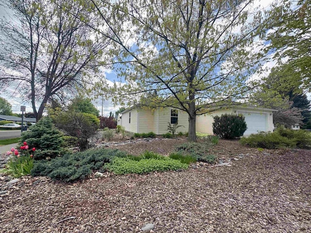 1937 E Vandal Dr, Moscow, ID 83843 - view of side of home featuring a garage