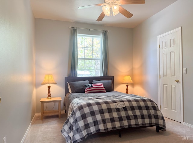 1937 E Vandal Dr, Moscow, ID 83843 - bedroom with light carpet, baseboards, and a ceiling fan