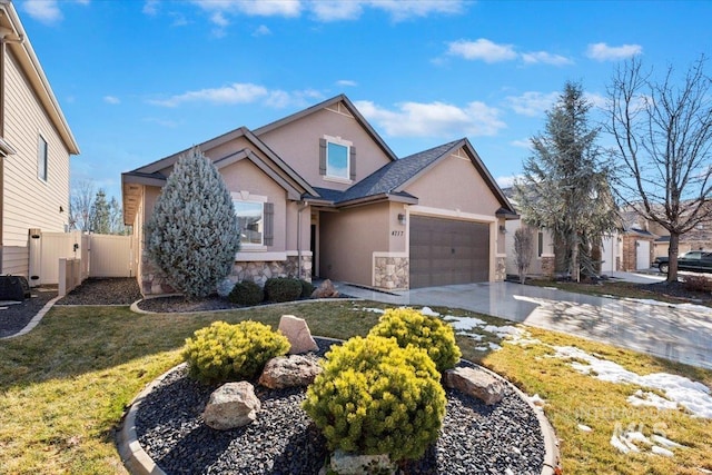 view of front of home featuring a garage and a front yard