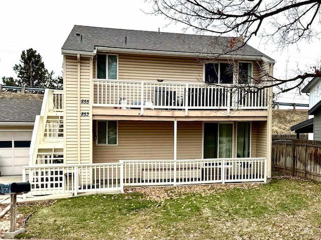 back of house featuring a yard