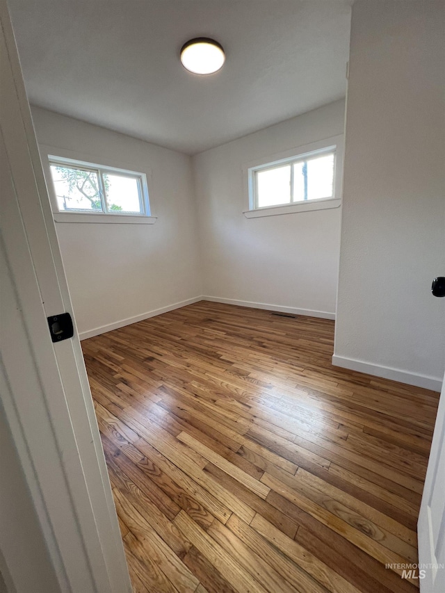 317 Baker Dr, Mountain Home, ID 83647 - unfurnished room featuring wood-type flooring and baseboards