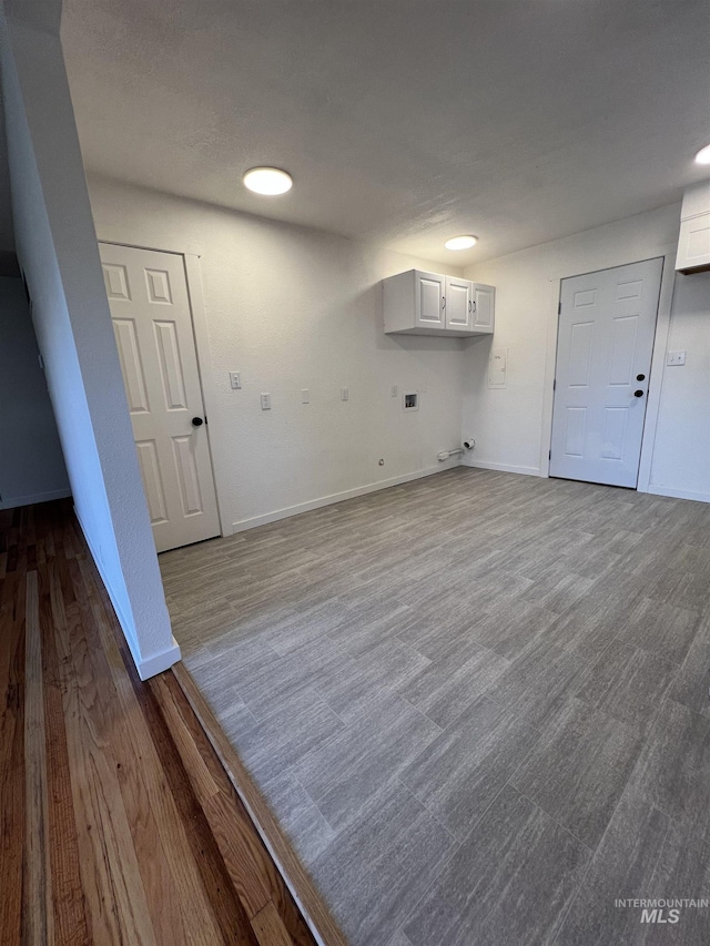 317 Baker Dr, Mountain Home, ID 83647 - washroom with cabinet space, dark wood-style floors, and baseboards