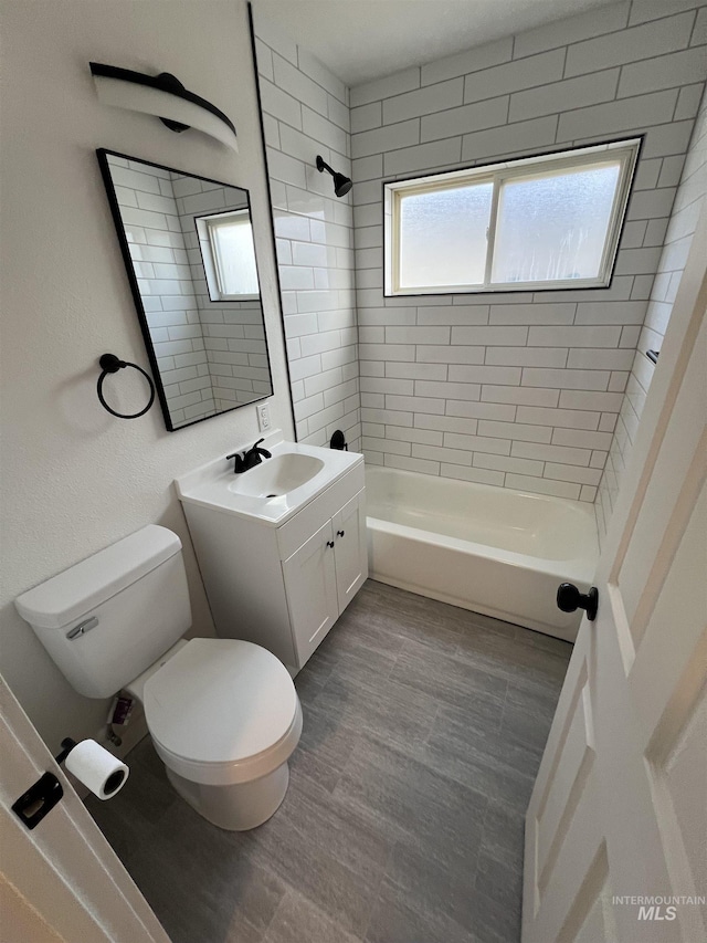 317 Baker Dr, Mountain Home, ID 83647 - full bath featuring toilet,  shower combination, and vanity