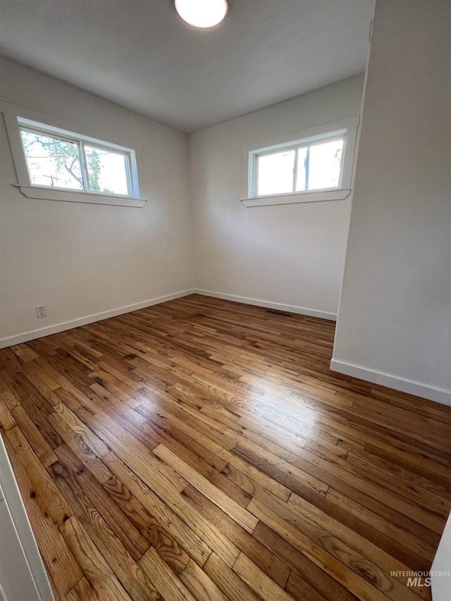 317 Baker Dr, Mountain Home, ID 83647 - unfurnished room with wood-type flooring and baseboards