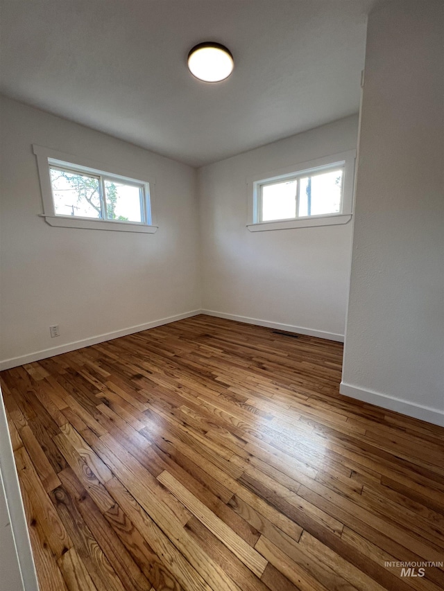 317 Baker Dr, Mountain Home, ID 83647 - unfurnished room with wood-type flooring and baseboards