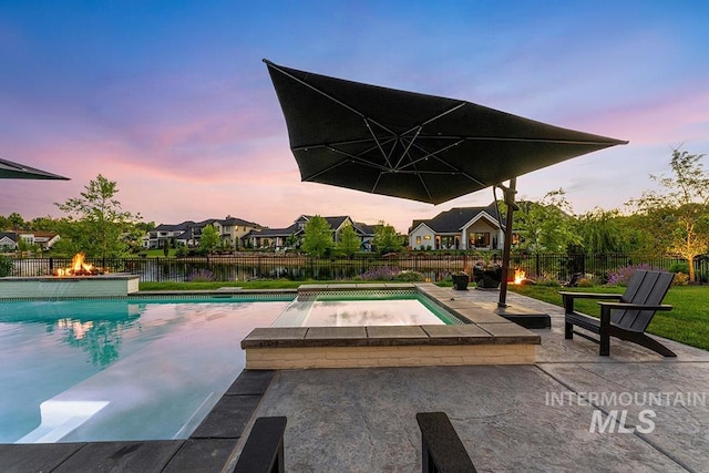 view of swimming pool featuring a fenced backyard, a fenced in pool, and a patio