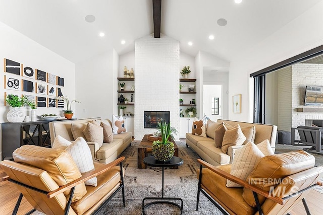 living room with beam ceiling, a fireplace, recessed lighting, wood finished floors, and high vaulted ceiling