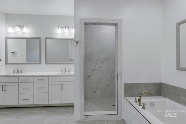 bathroom featuring tile patterned floors, vanity, and plus walk in shower