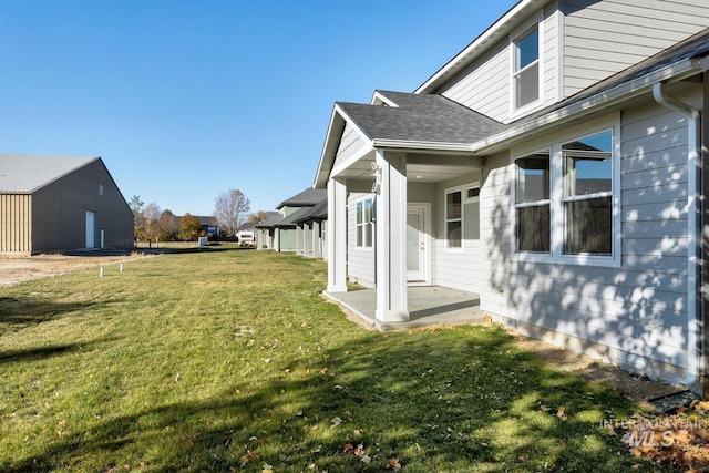 view of side of property with a yard