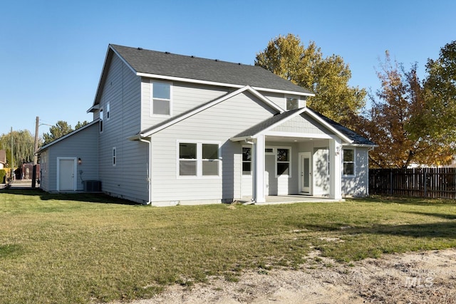 rear view of property with central AC, a yard, and a patio