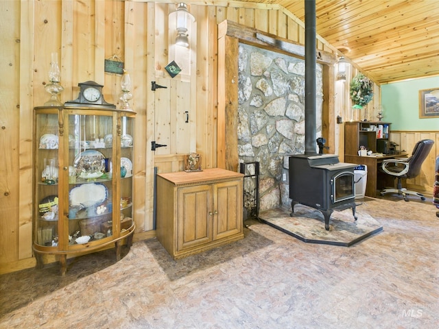 4474 Council Cuprum Rd, Council, ID 83612 - home office featuring wood ceiling, a wood stove, wooden walls, wainscoting, and lofted ceiling