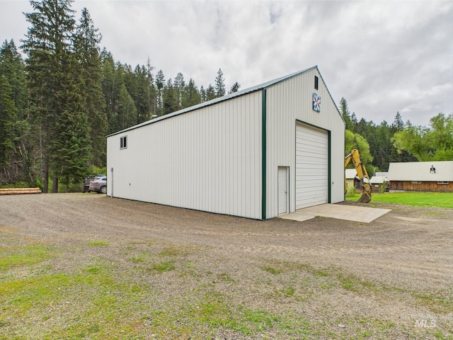 4474 Council Cuprum Rd, Council, ID 83612 - detached garage featuring dirt driveway and a view of trees