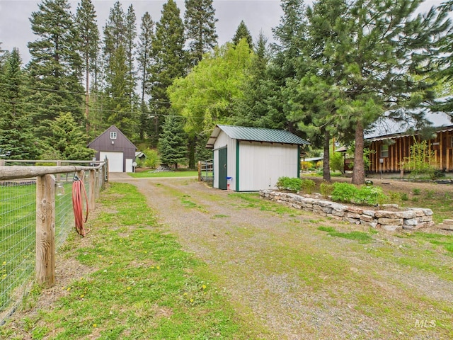 4474 Council Cuprum Rd, Council, ID 83612 - view of yard featuring a detached garage, an outdoor structure, and driveway