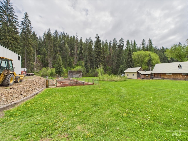 4474 Council Cuprum Rd, Council, ID 83612 - view of green lawn with a garden and a view of trees