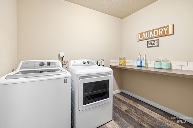 16848 Loggia Ave, Caldwell, ID 83607 - laundry room featuring washing machine and dryer, wood finished floors, a textured ceiling, and baseboards