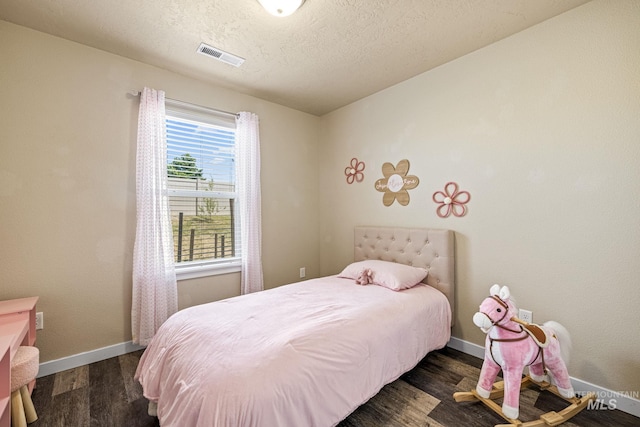 16848 Loggia Ave, Caldwell, ID 83607 - bedroom with dark wood-style floors and baseboards