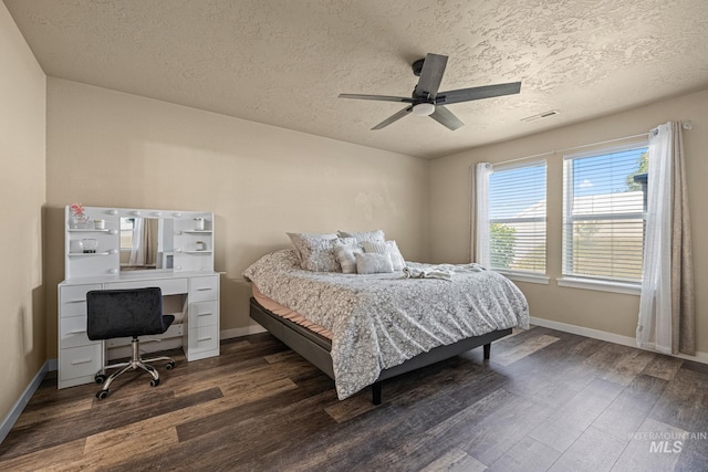 16848 Loggia Ave, Caldwell, ID 83607 - bedroom with dark wood-style floors, a textured ceiling, baseboards, an office area, and ceiling fan