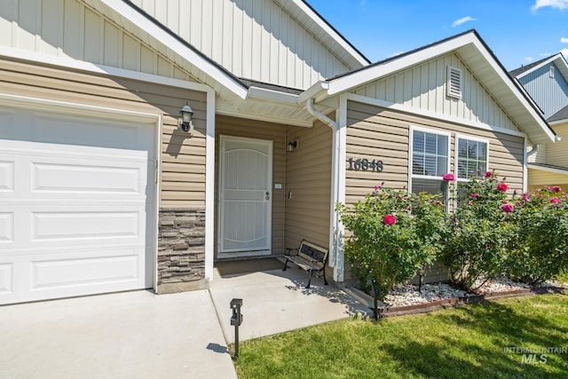 16848 Loggia Ave, Caldwell, ID 83607 - view of exterior entry with board and batten siding and a garage