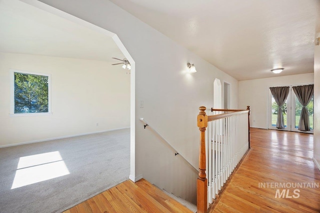 646 W Falls Ave, Twin Falls, ID 83301 - hallway with an upstairs landing, plenty of natural light, light wood finished floors, and light carpet