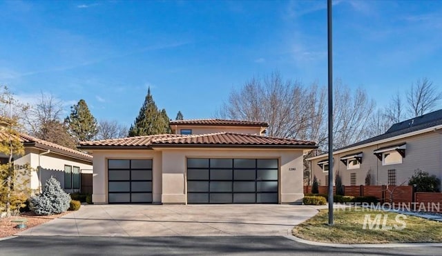 view of front facade with a garage and an outdoor structure