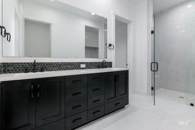 2386 N Leatherwood Ave, Star, ID 83669 - bathroom featuring a marble finish shower, decorative backsplash, double vanity, and marble finish flooring