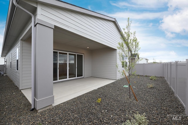 2386 N Leatherwood Ave, Star, ID 83669 - back of property featuring a fenced backyard and a patio