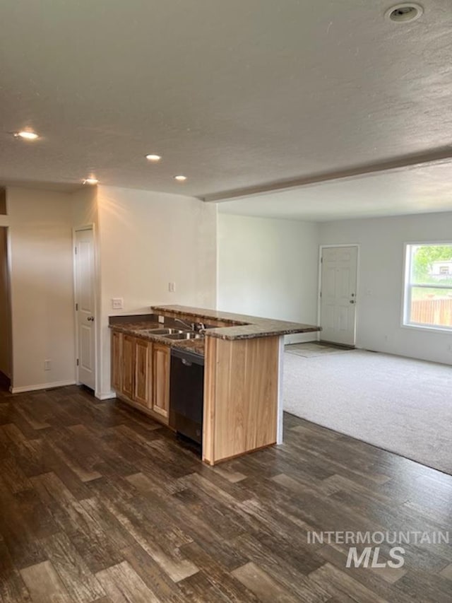 kitchen with dishwasher, recessed lighting, open floor plan, dark wood-style flooring, and a sink